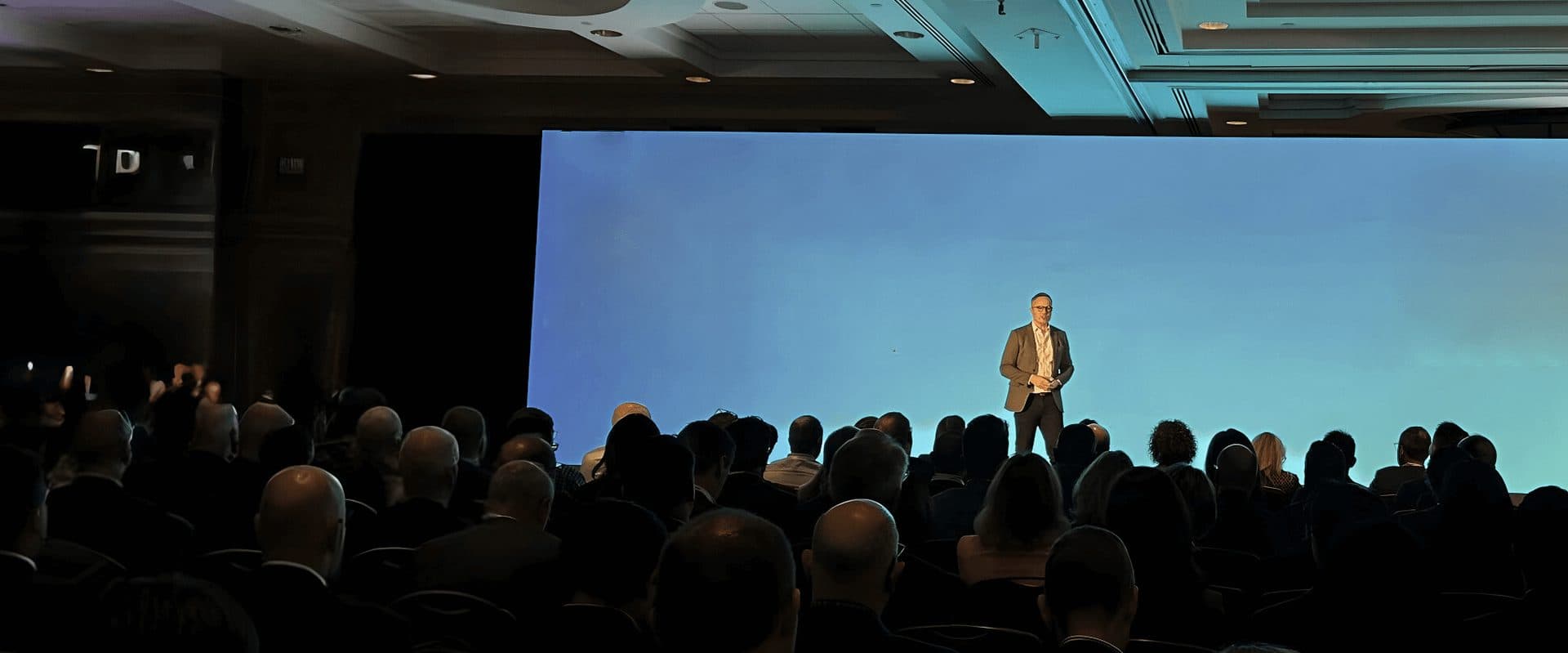 Caleb Gardner delivering a keynote presentation